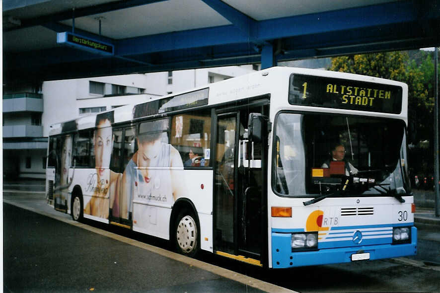 (063'906) - RTB Altst�tten - Nr. 30/SG 243'853 - Mercedes (ex VBSG St. Gallen Nr. 221) am 9. Oktober 2003 beim Bahnhof Heerbrugg