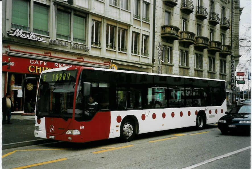 (066'132) - TPF Fribourg - Nr. 388/FR 300'393 - Mercedes am 21. M�rz 2004 beim Bahnhof Fribourg