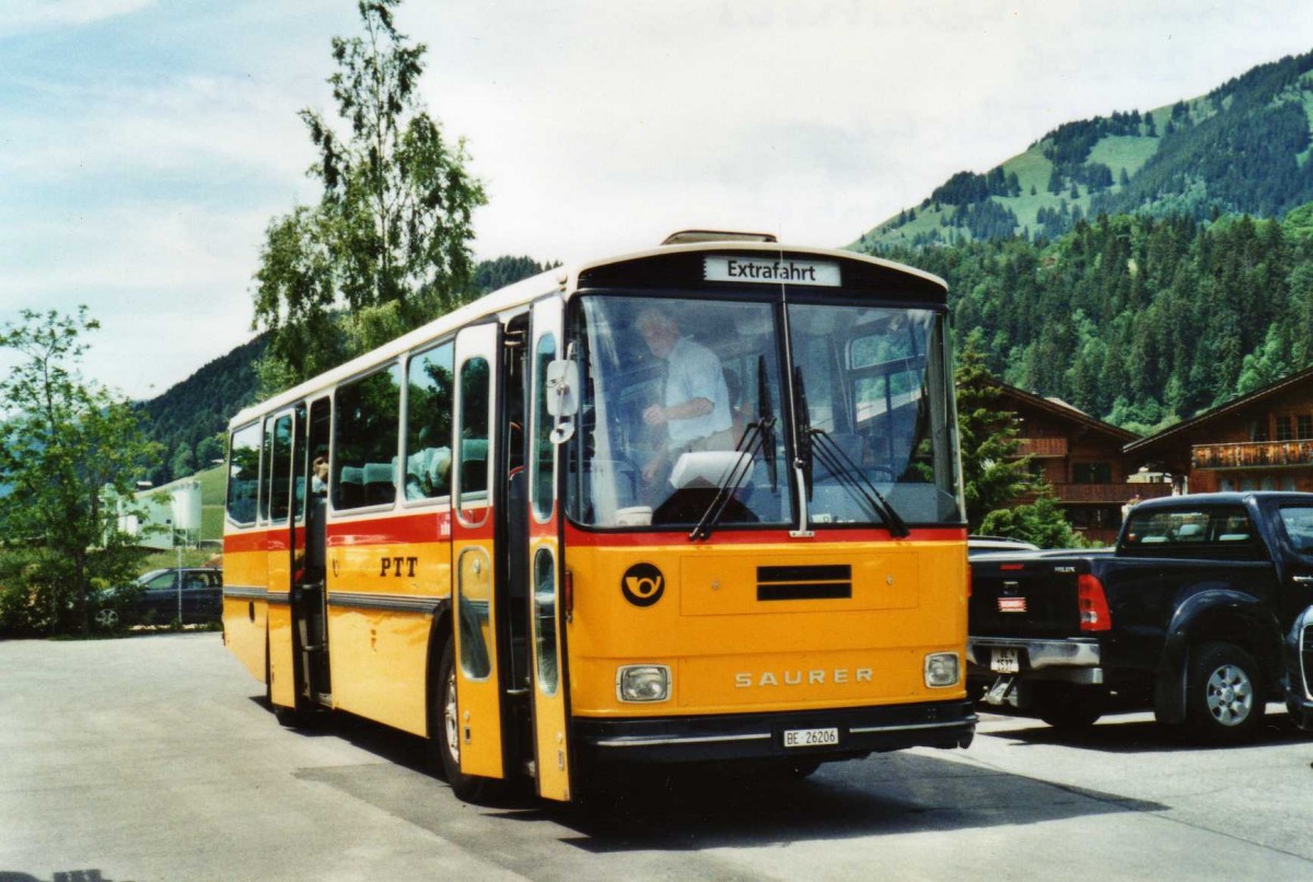 (117'635) - Schmid, Th�rishaus - BE 26'206 - Saurer/T�scher (ex P 24'244) am 14. Juni 2009 beim Bahnhof Saanen