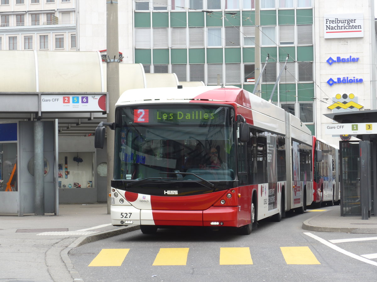 (169'238) - TPF Fribourg - Nr. 527 - Hess/Hess Gelenktrolleybus am 13. M�rz 2016 beim Bahnhof Fribourg