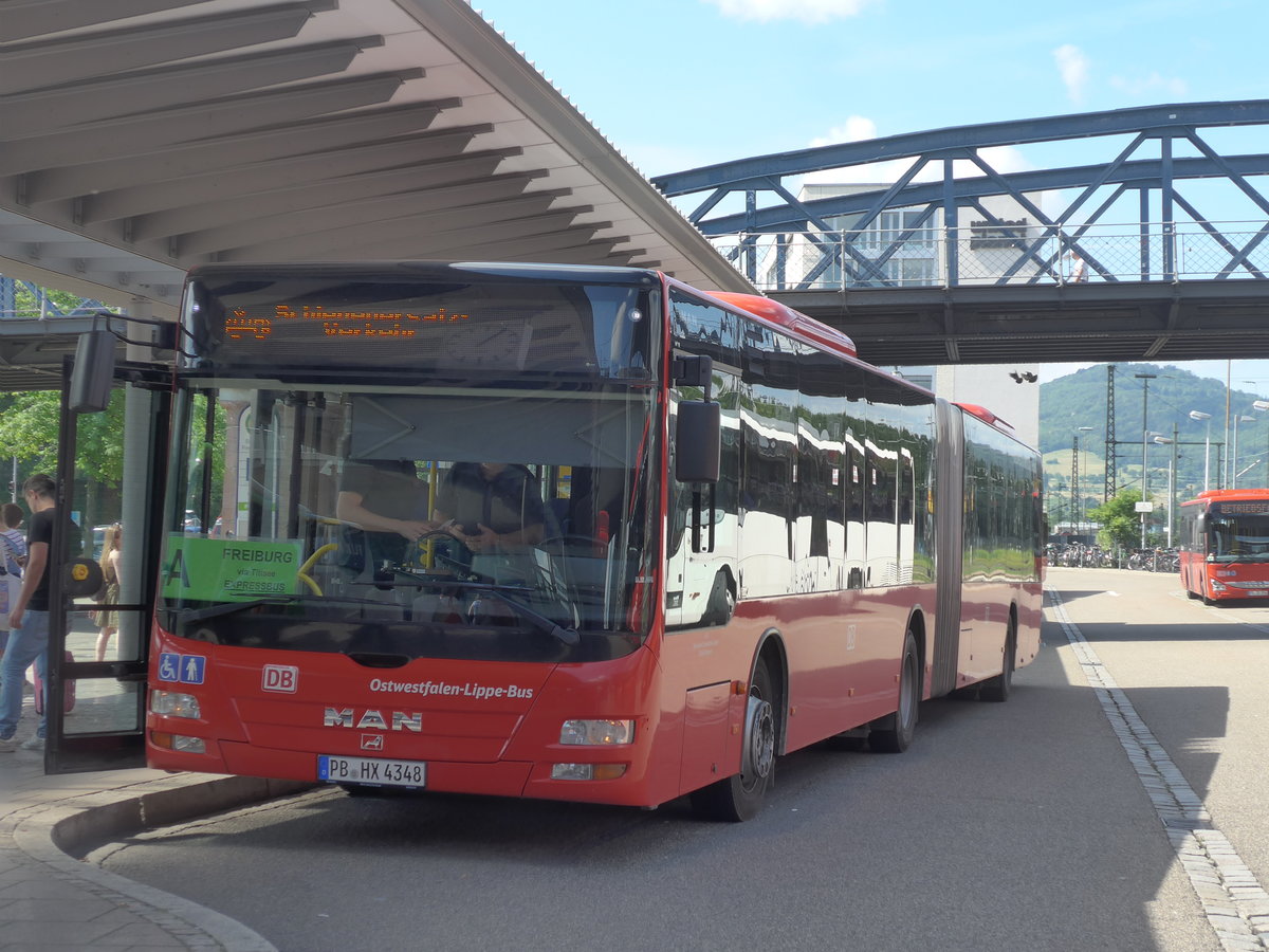 (194'186) - OLB M�nster - PB-HX 4348 - MAN am 18. Juni 2018 beim Bahnhof Freiburg