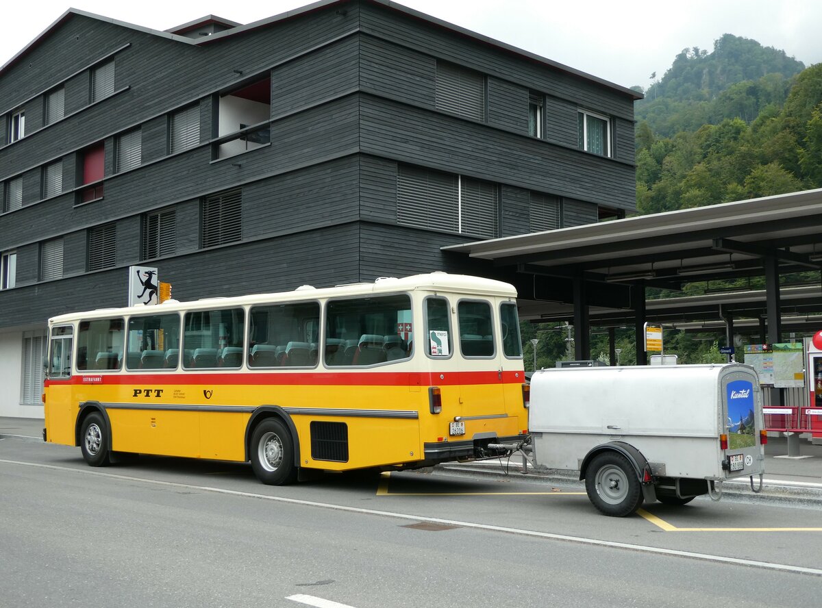 (239'815) - Schmid, Th�rishaus - BE 26'206 - Saurer/T�scher (ex P 24'244) am 28. August 2022 beim Bahnhof Giswil