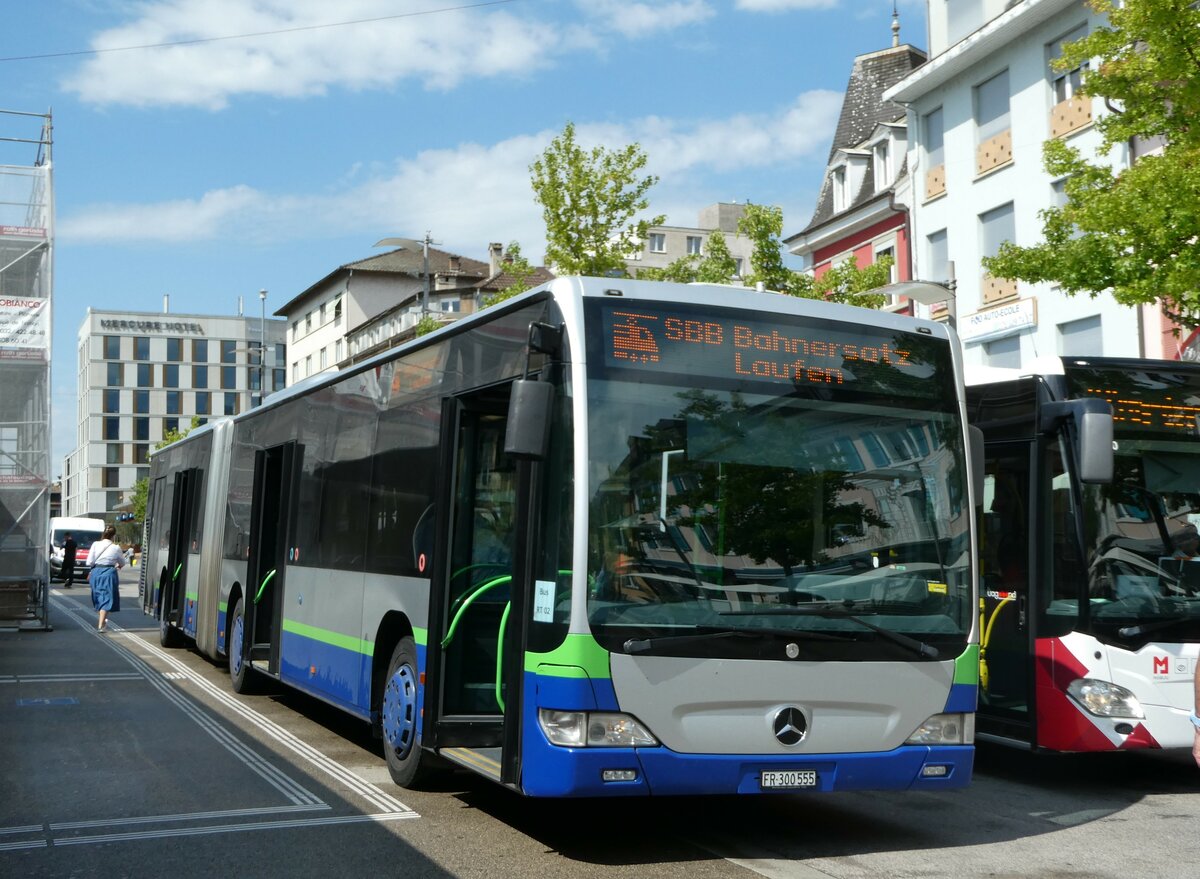 (253'684) - Intertours, Domdidier - Nr. 555/FR 300'555 - Mercedes (ex Nr. 412; ex TPL Lugano Nr. 412) am 12. August 2023 beim Bahnhof Del�mont