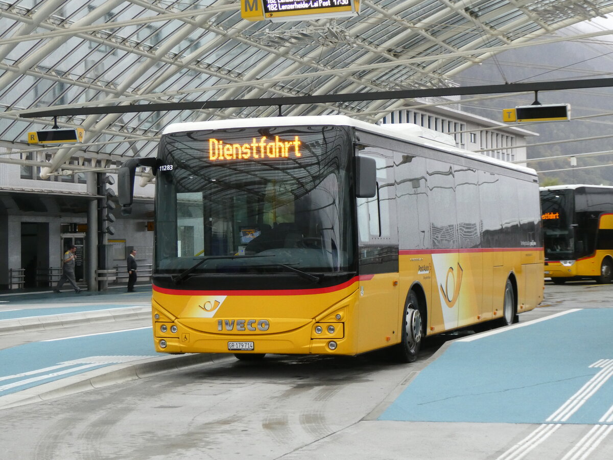 (267'899) - PostAuto Graub�nden - GR 179'714/PID 11'283 - Iveco am 8. Oktober 2024 in Chur, Postautostation