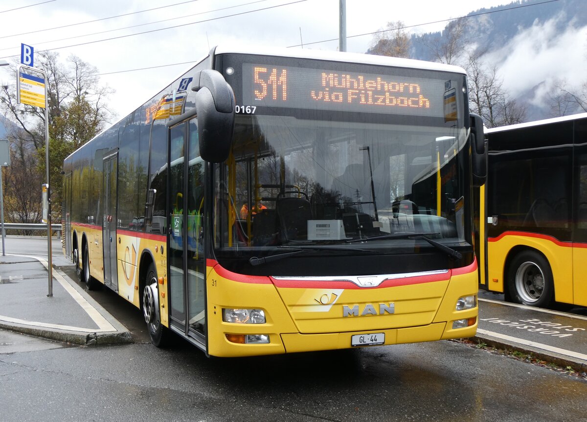 (269'253) - Niederer, Filzbach - Nr. 31/GL 44/PID 10'167 - MAN (ex Schwizer, Goldach; ex Casutt, Gossau) am 19. November 2024 beim Bahnhof Ziegelbr�cke
